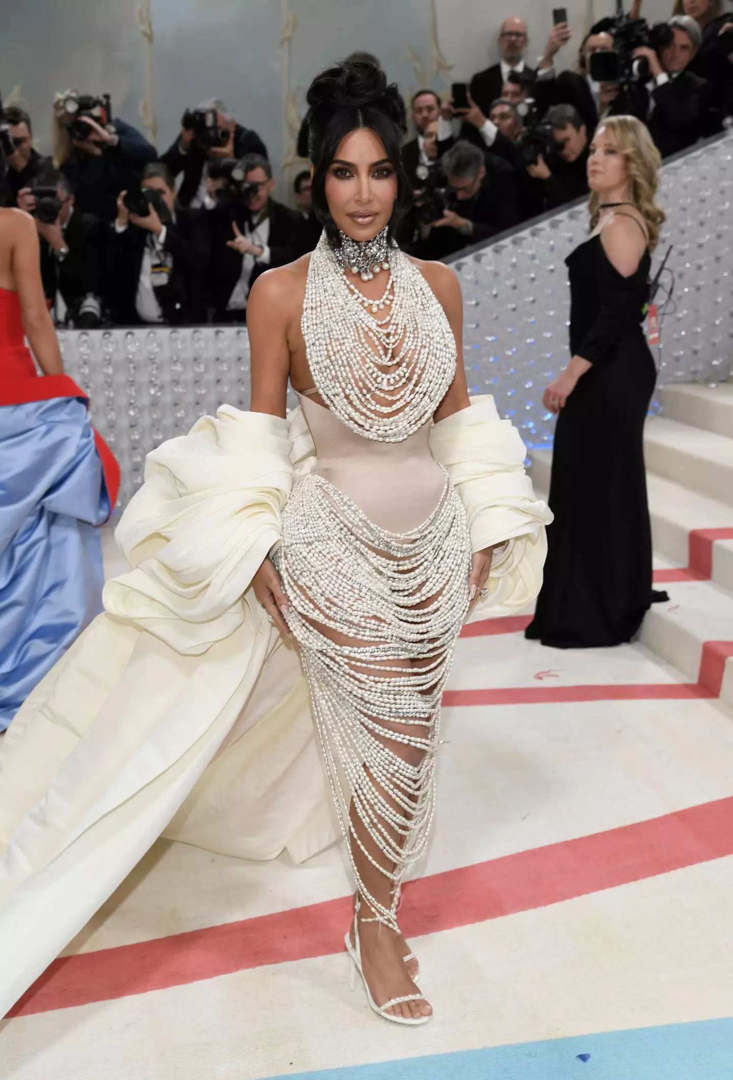 Kim Kardashian stepped out onto the red (white and blue) carpet at 2023's Met Gala.