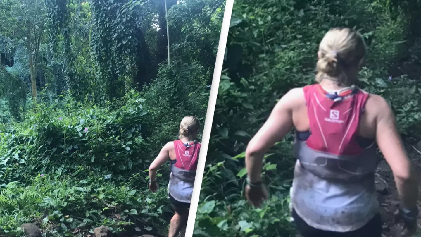 Photo captures terrifying 'nightmarcher' watching unsuspecting woman during rainforest race
