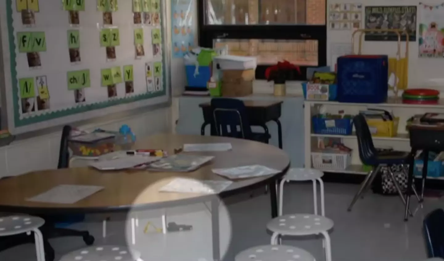 A gun is seen on the floor of the classroom (NBC News)