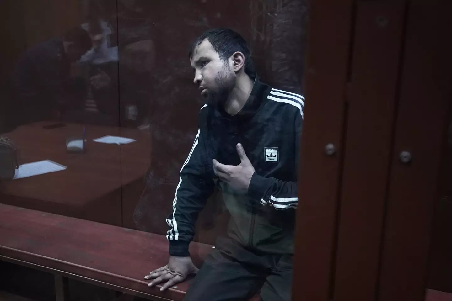 The suspects appeared to be injured as they arrived to court.