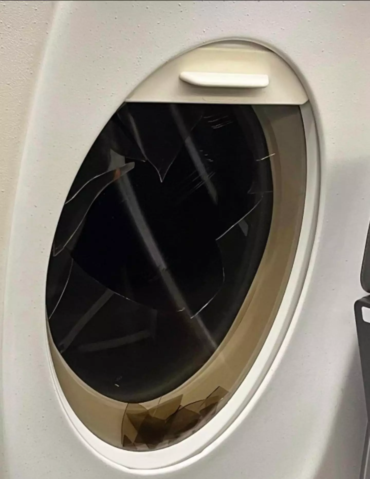 The window that was allegedly broken on the flight.