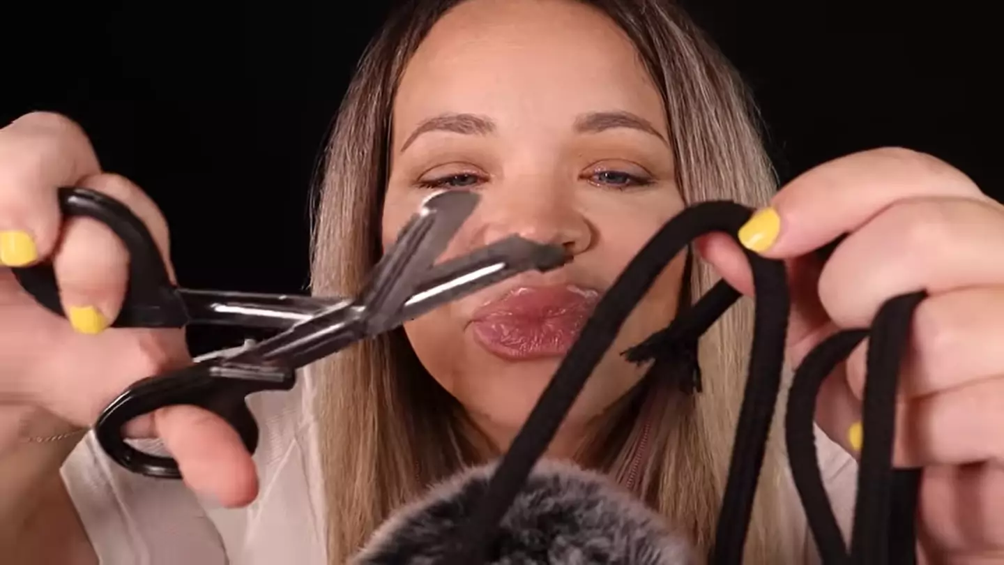 The YouTuber cut a piece of string like an umbilical cord as part of the ASMR.