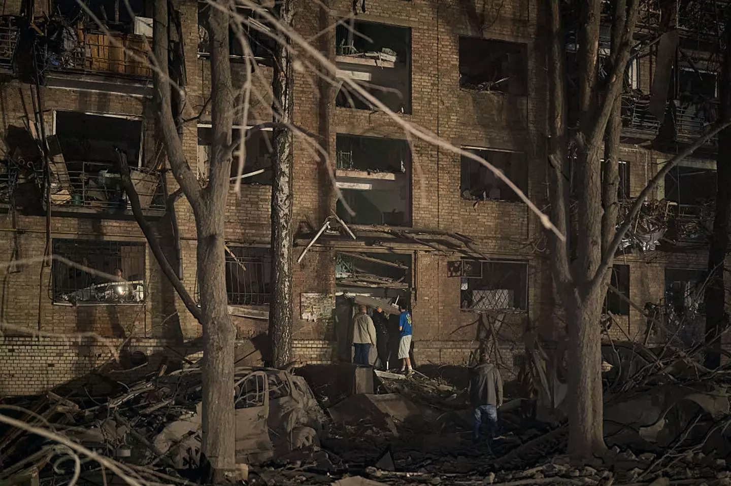 Rescuers and civilians worked to pull victims from the rubble of a missile strike on a residential building that took place in the early hours of this morning, local time (Kostiantyn Liberov/Libkos/Getty Images)