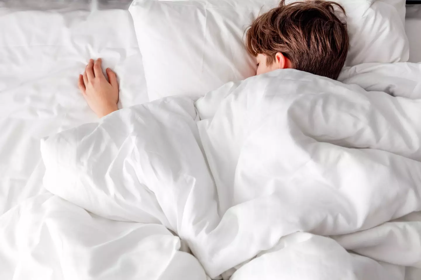 Sleeping on your front can be tough on your neck and spine (Getty Stock Photo)