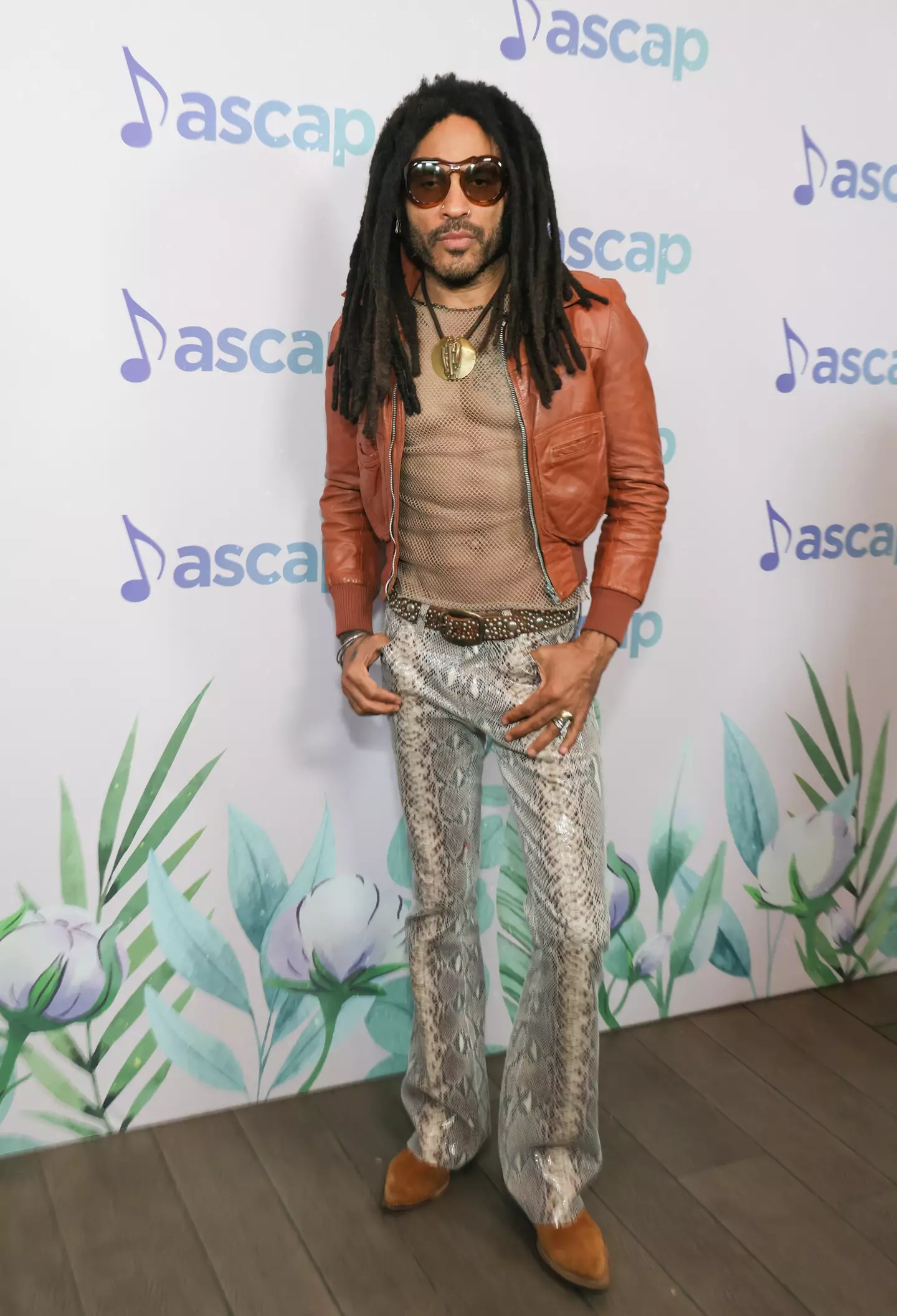 Lenny Kravitz loves a mesh shirt.