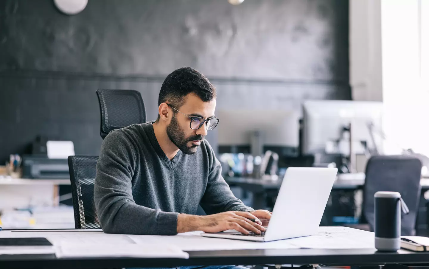 Turns out your worry about being watched through your work laptop isn't completely unfounded (Getty Stock Images/ Visualspace)