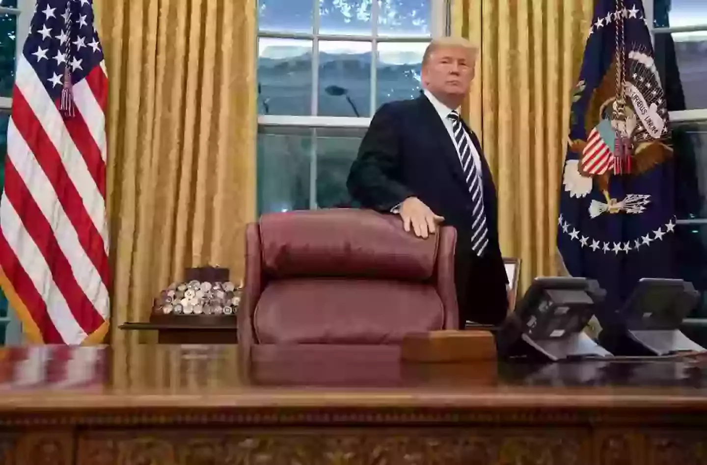 The red button sits on the Oval Office's Resolute Desk (SAUL LOEB/AFP via Getty Images)