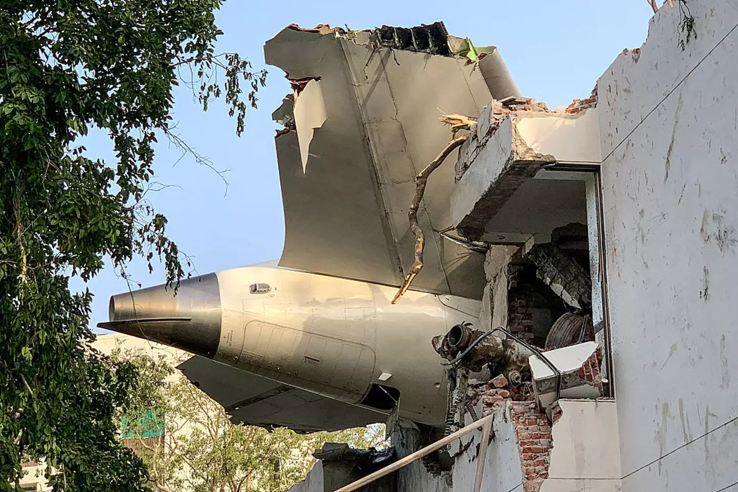 The back of Air India flight 171 is pictured at the site after it crashed in a residential area near the airport in Ahmedabad on June 12, 2025. A London-bound passenger plane crashed in the Indian city of Ahmedabad on June 12 (SAM PANTHAKY/AFP via Getty Images)