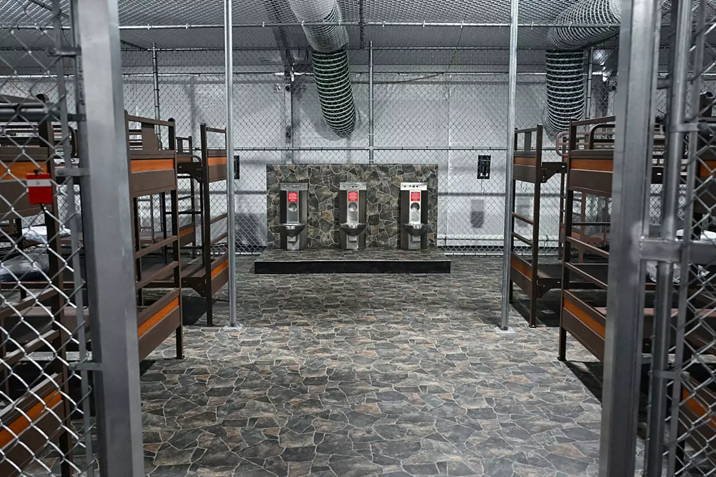 Toilets and beds inside the detention center (ANDREW CABALLERO-REYNOLDS/AFP via Getty Images)