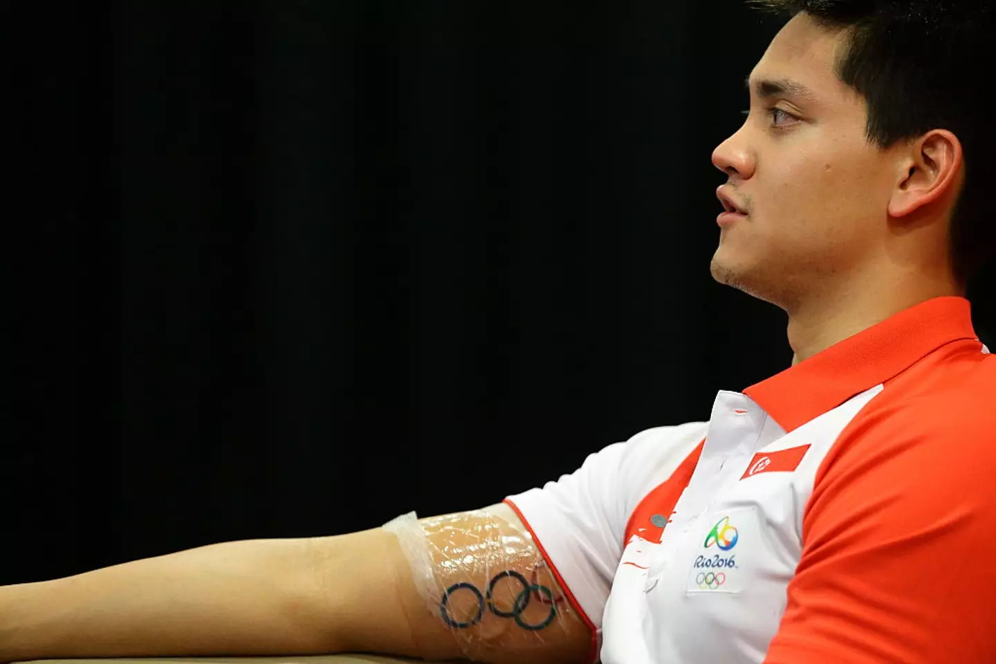 Singaporean Swimmer Joseph Schooling showing off his new Olympic ink. (Suhaimi Abdullah/Getty Images)