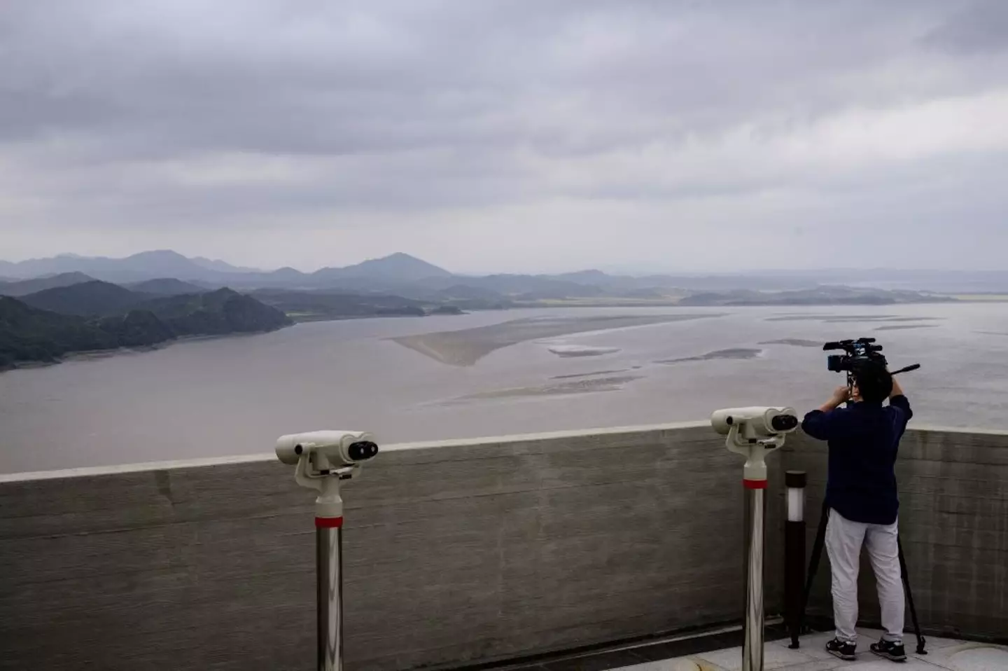 Starbucks customers can enjoy their lattes while looking over at Gaepung county at Aeigibong Peace Ecopark in Gimpo, Gyeonggi Province (ANTHONY WALLACE/AFP via Getty Images)