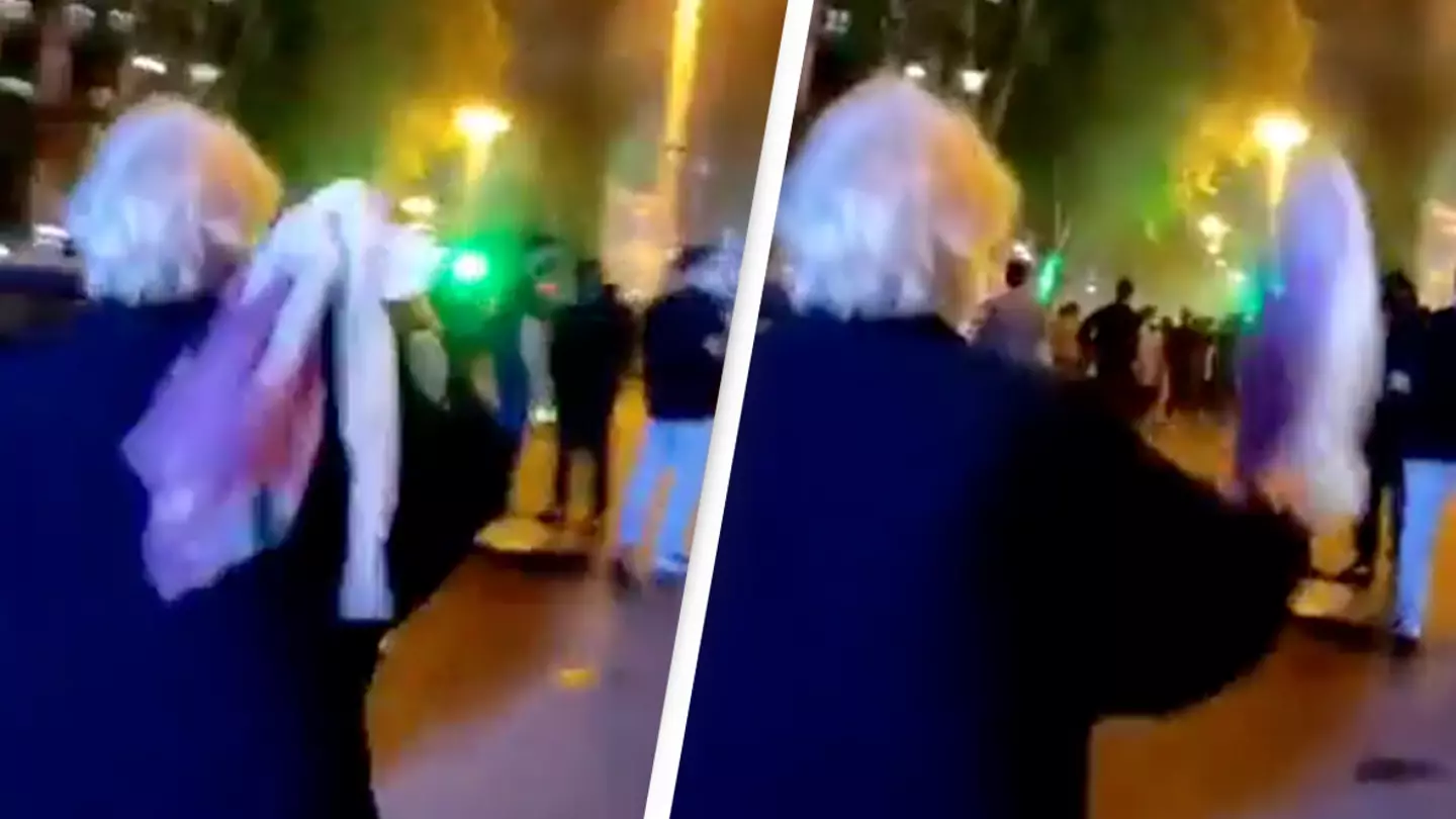 Elderly woman removes hijab and screams 'death to Khamenei' as protests rage across Iran