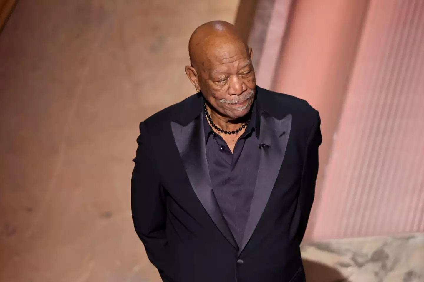 The actor had his hands behind his back for most of his speech (Rich Polk/Penske Media via Getty Images)