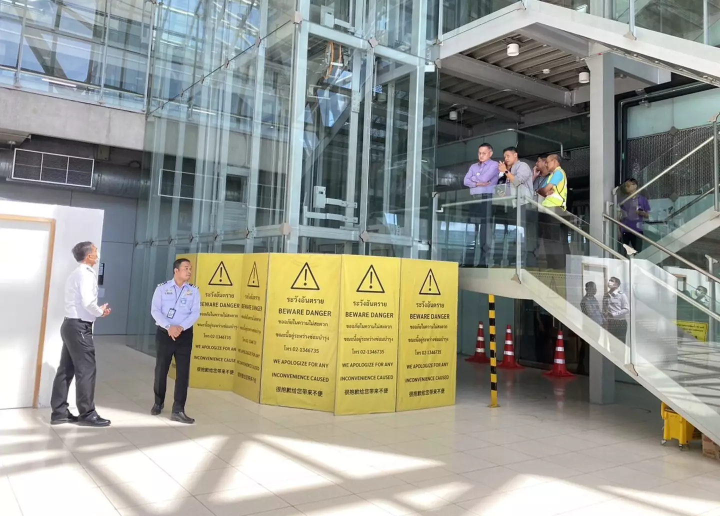 The airport worker was crushed by a glass elevator. (Asia Pacific Press via ViralPress)