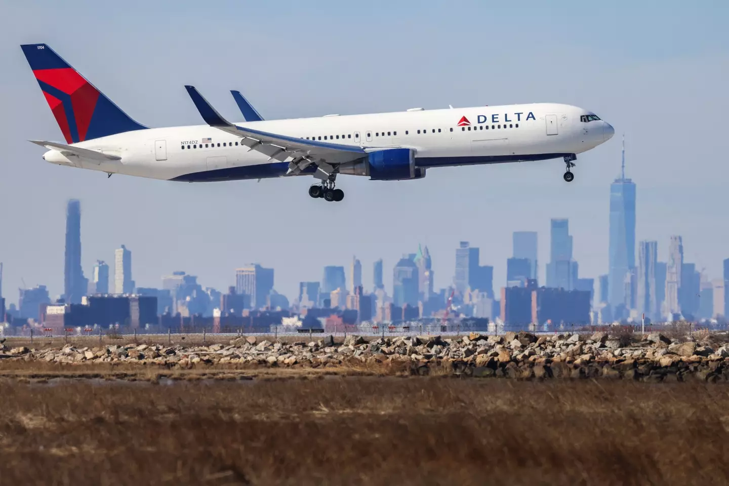 Last week, in what would have been a terrifying moment for passengers, the emergency slide fell off of a Delt airplane while it was in the air. (CHARLY TRIBALLEAU/AFP via Getty Images)