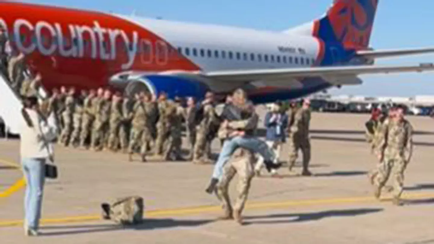 The woman embraced the soldier.