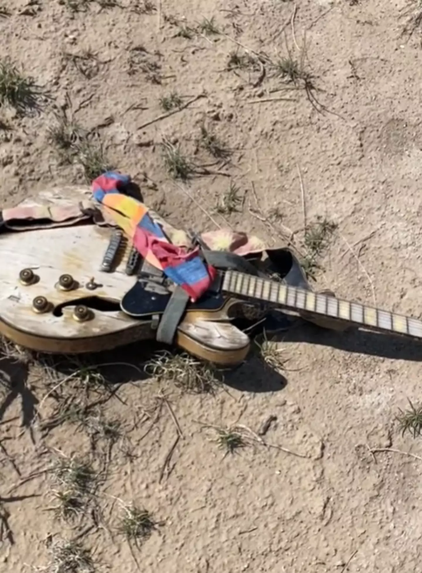 Ryan came across a discarded guitar in the desert.