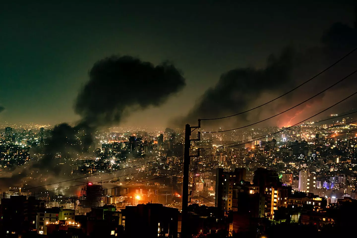 Tehran was seen burning on Sunday after three days of Israeli strikes (KHOSHIRAN/Middle East Images/AFP via Getty Images)