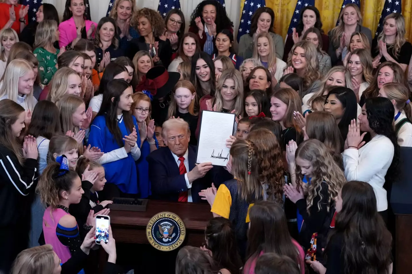 President Donald Trump signed an order banning trans women and girls from competing in women's sport (Andrew Harnik/Getty Images)