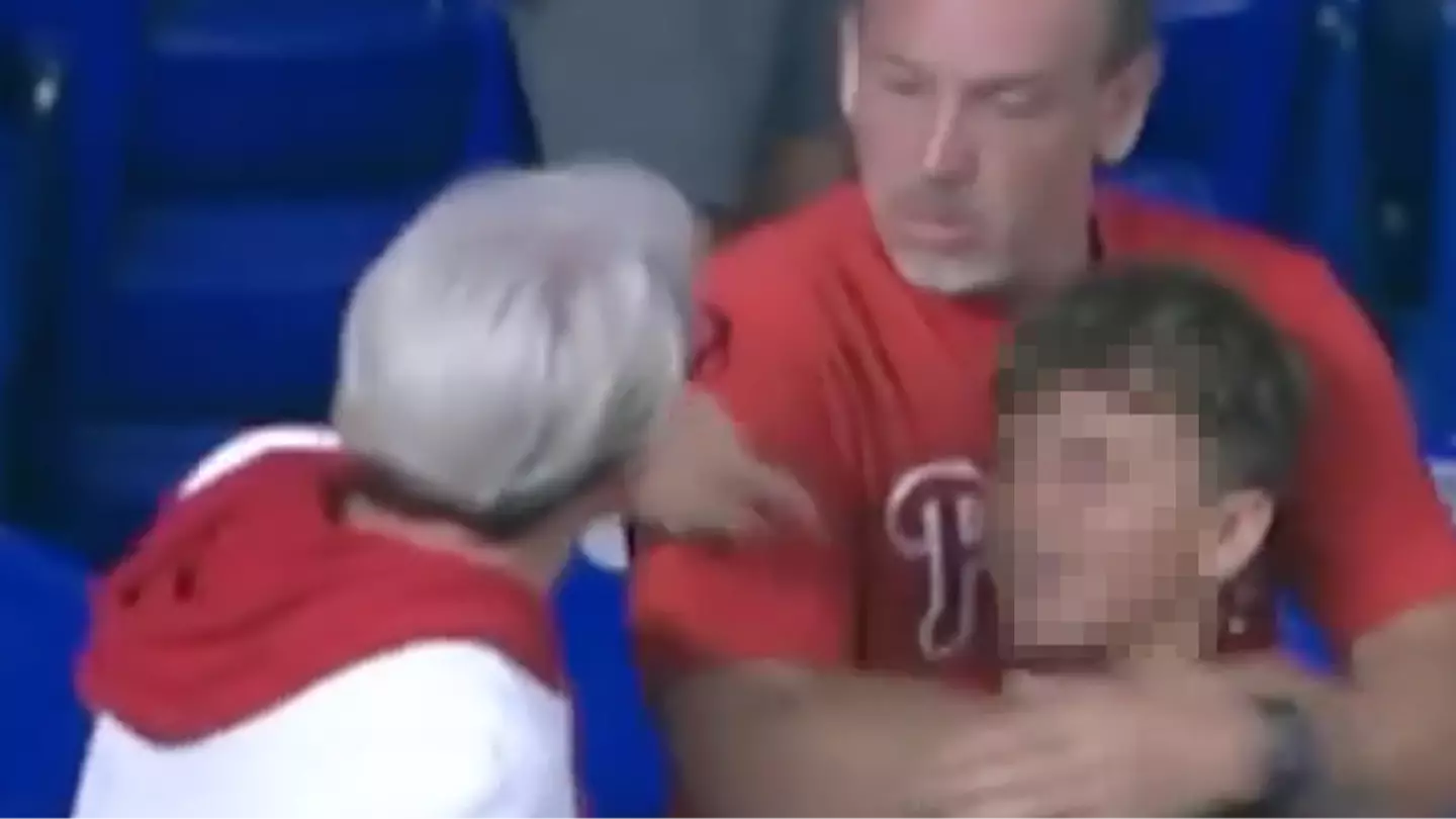 Grown woman caught on live TV doing controversial act to child and father at MLB game