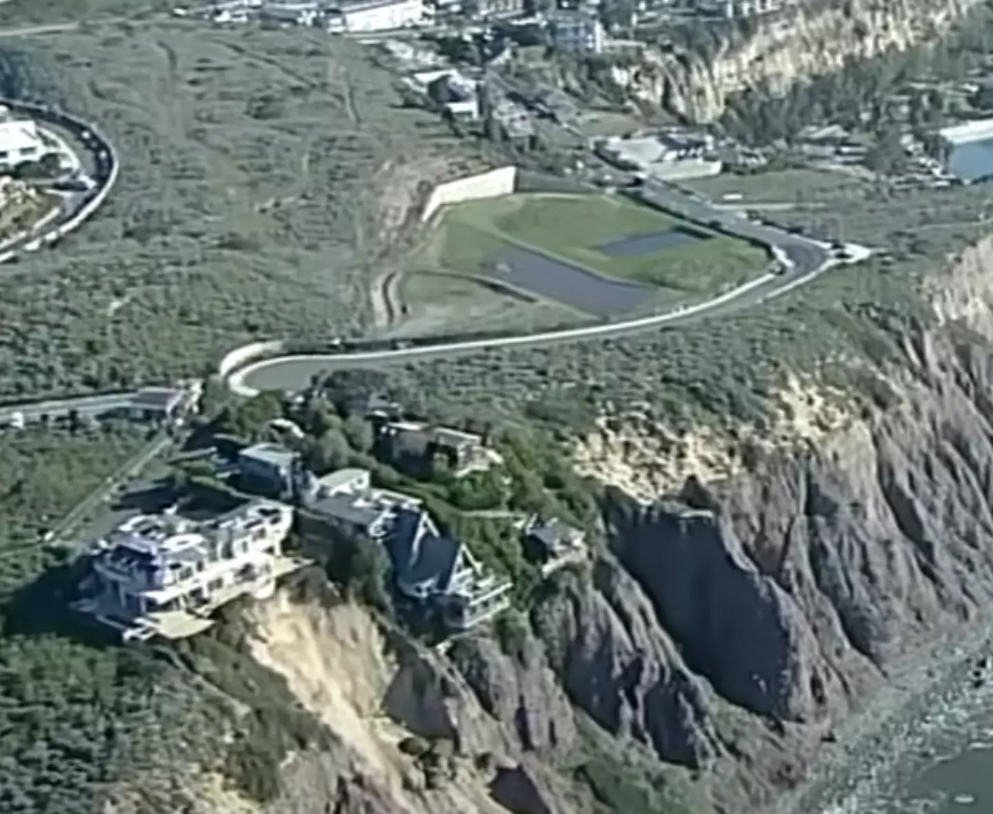 The three homes have been evaluated as structurally sound despite their position on the cliff's edge.