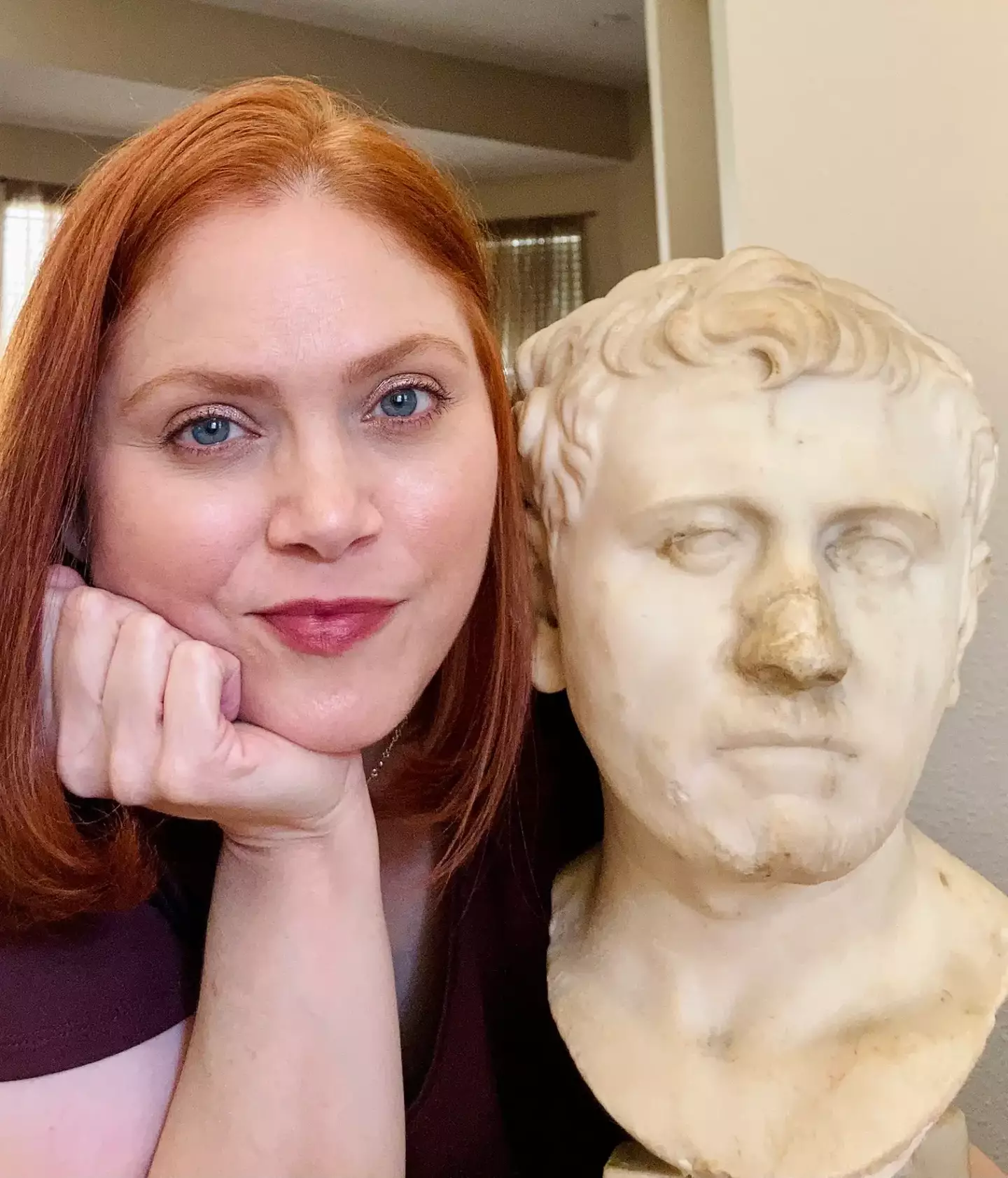 Laura Young with the 2,000 year old bust that she discovered.