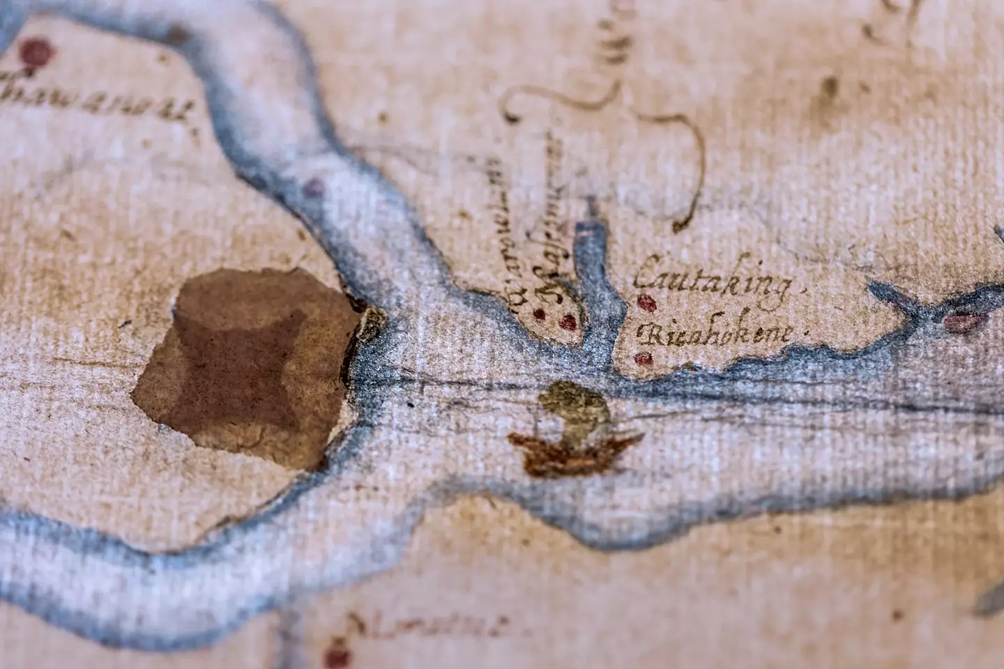 This 16th-century map of what is now coastal North Carolina appears to show a fort concealed under a patch and visible only by backlighting (British Museum)