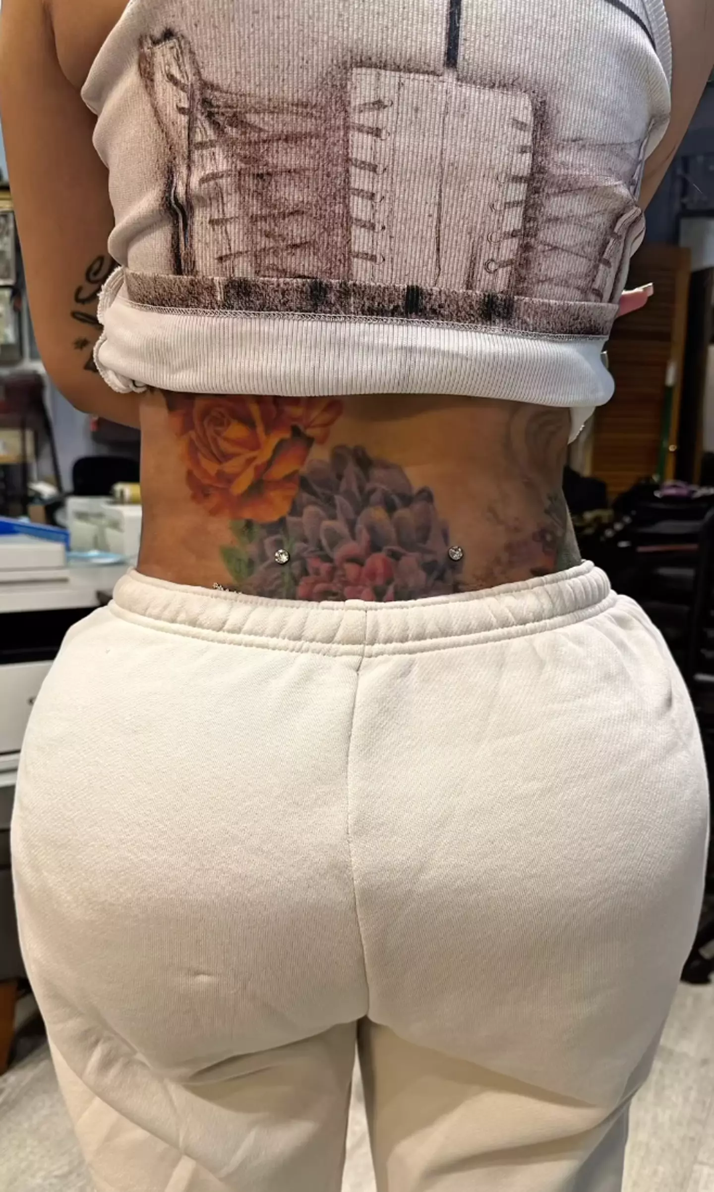Cardi B's new lower back piercing is a fair bit higher than her last one (Instagram/@iamcardib