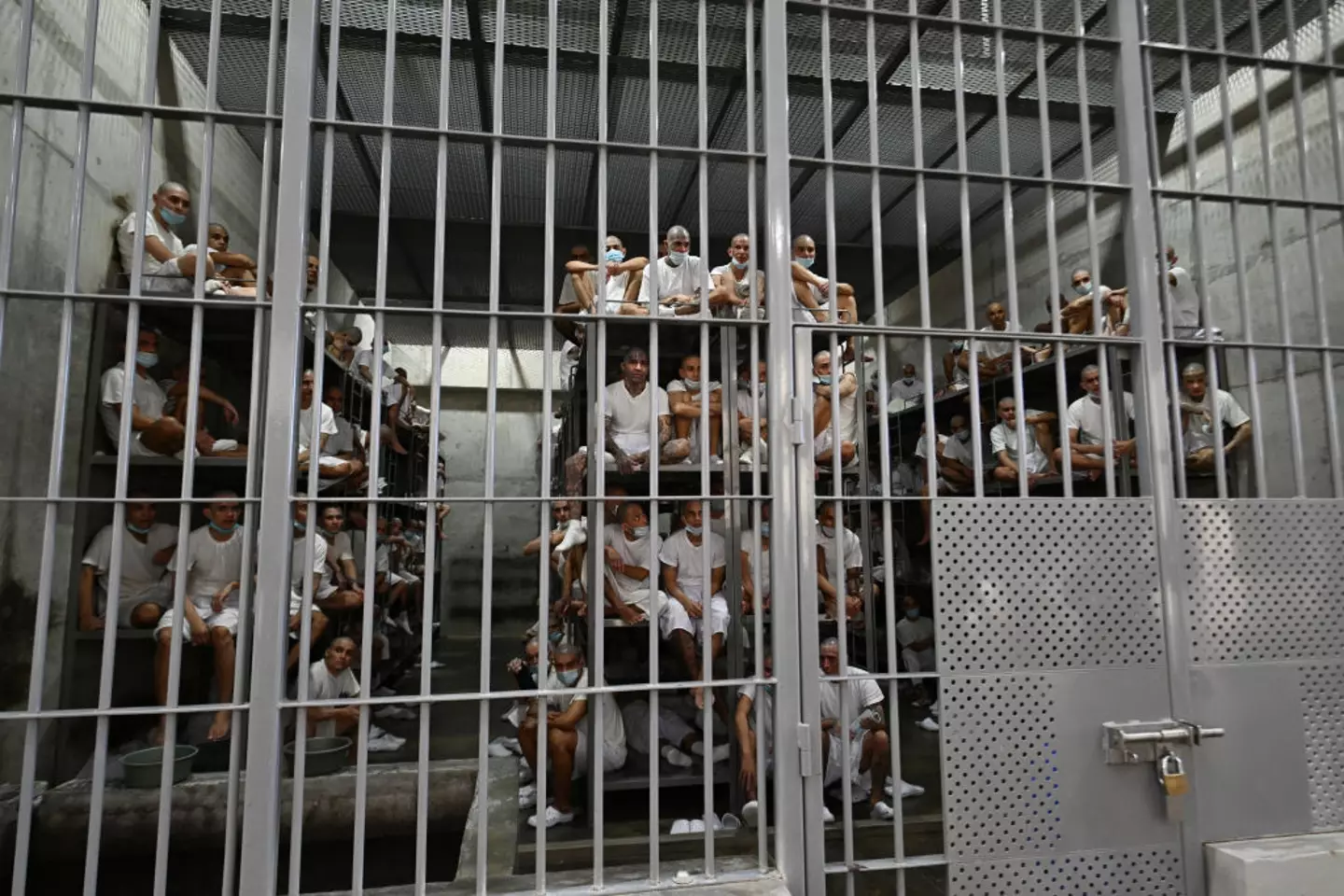 Inmates remain in a cell at the Counter-Terrorism Confinement Centre (CECOT) mega-prison, where hundreds of members of the MS-13 and 18 Street gangs are being held, in Tecoluca, El Salvador (MARVIN RECINOS/AFP via Getty Images)