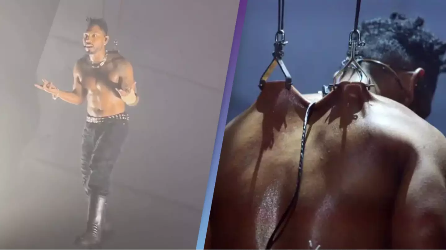 Miguel pierces his back with metal hooks hanging on his bare skin for shocking performance