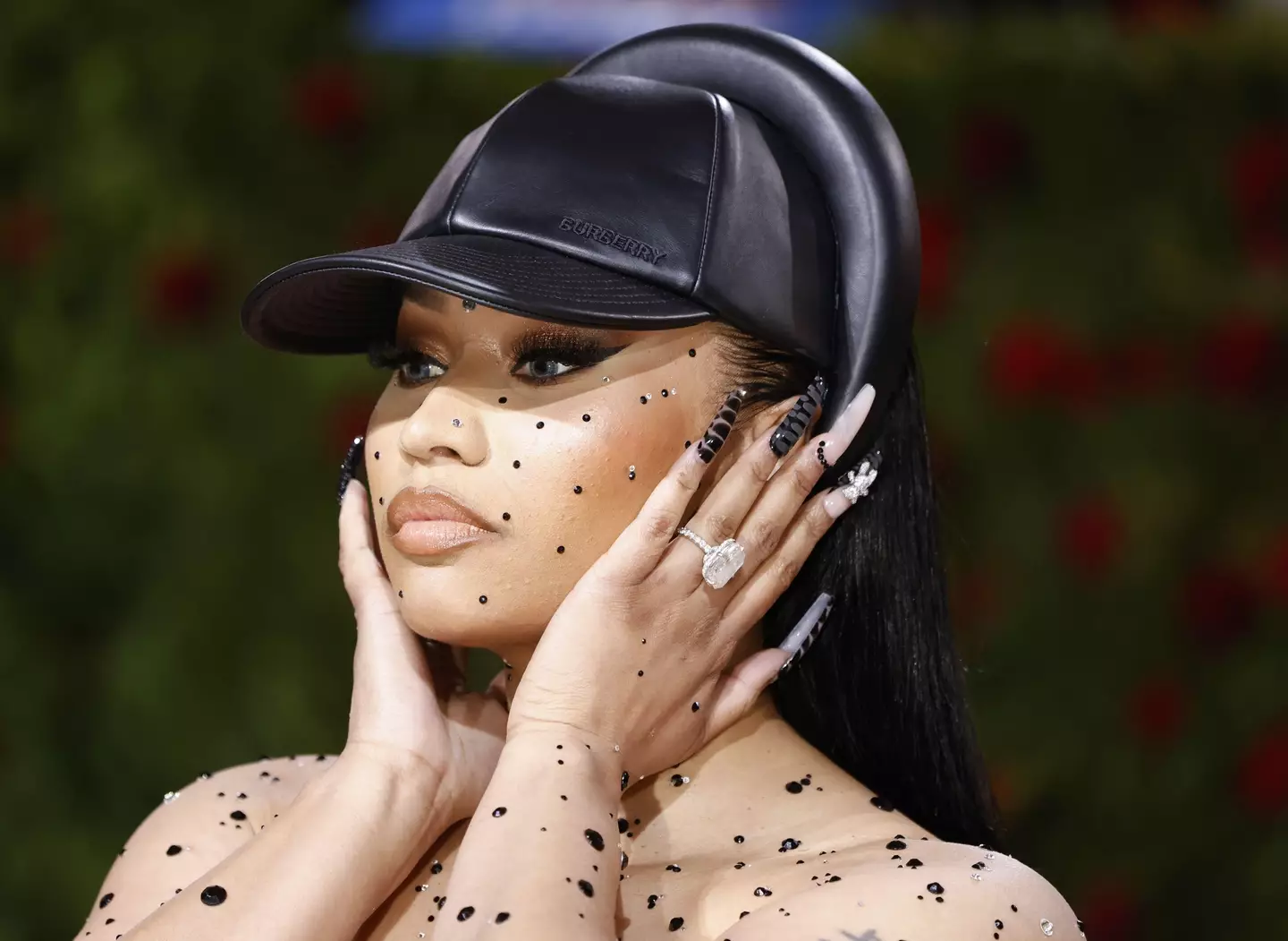 Nicki Minaj is suing a blogger who called her a 'cokehead' that is 'shoving in all this cocaine up her nose'.