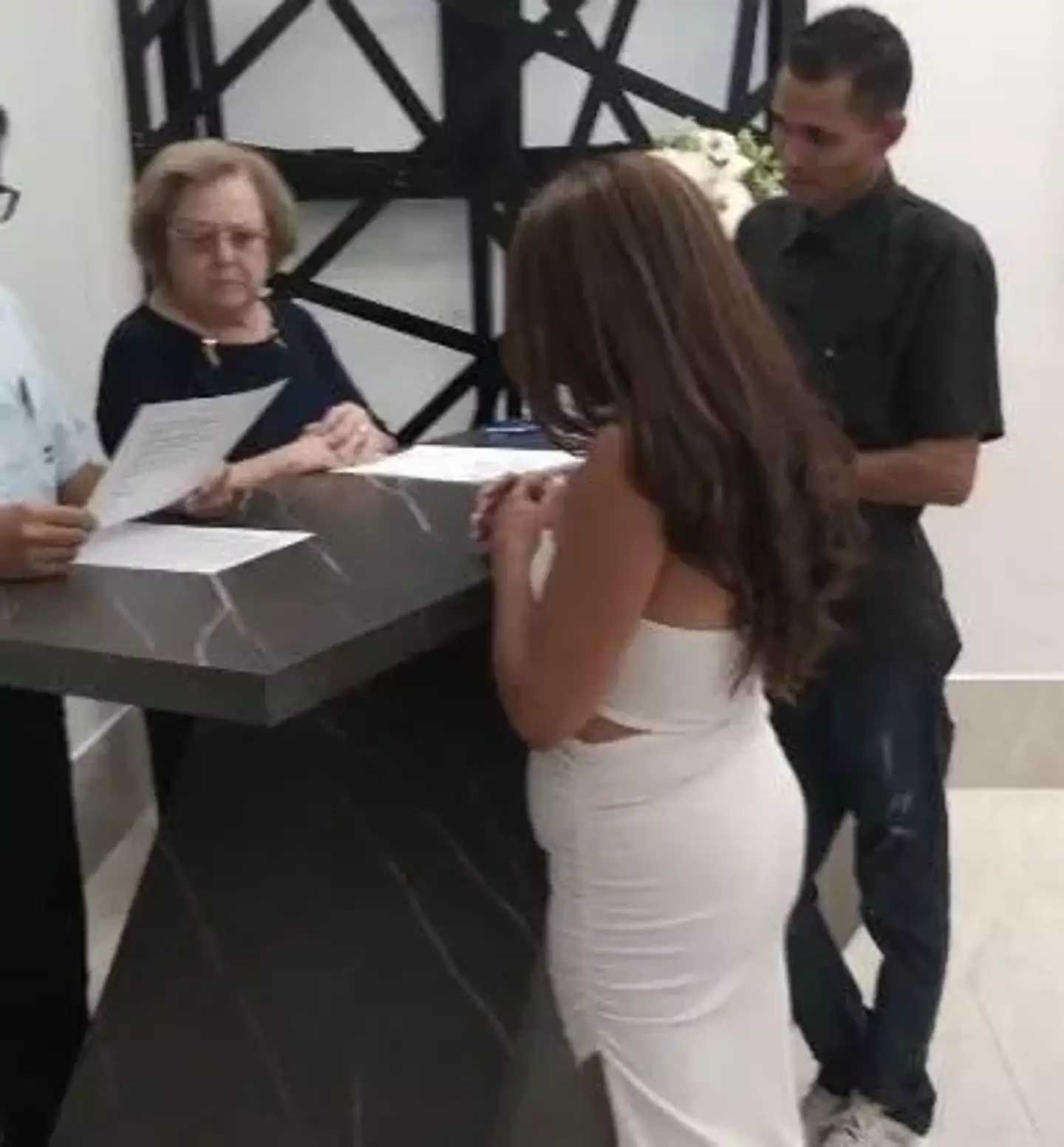 Elisangela was pictured signing paperwork at her wedding hours earlier (Zhivko Mironov)