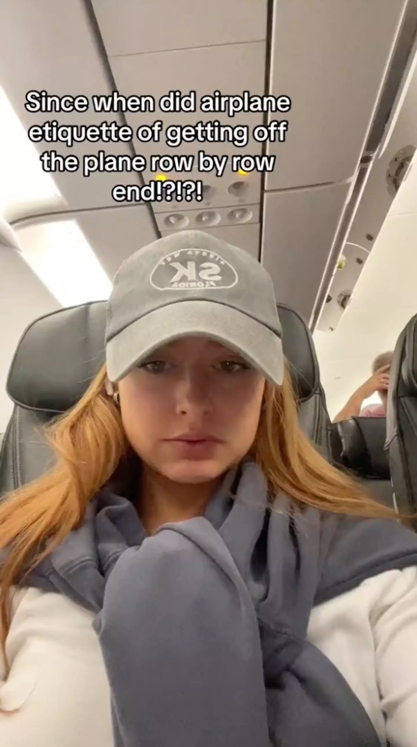 A passenger has sparked a fierce debate about ‘plane etiquette’ after questioning why people rush to exit the aircraft.