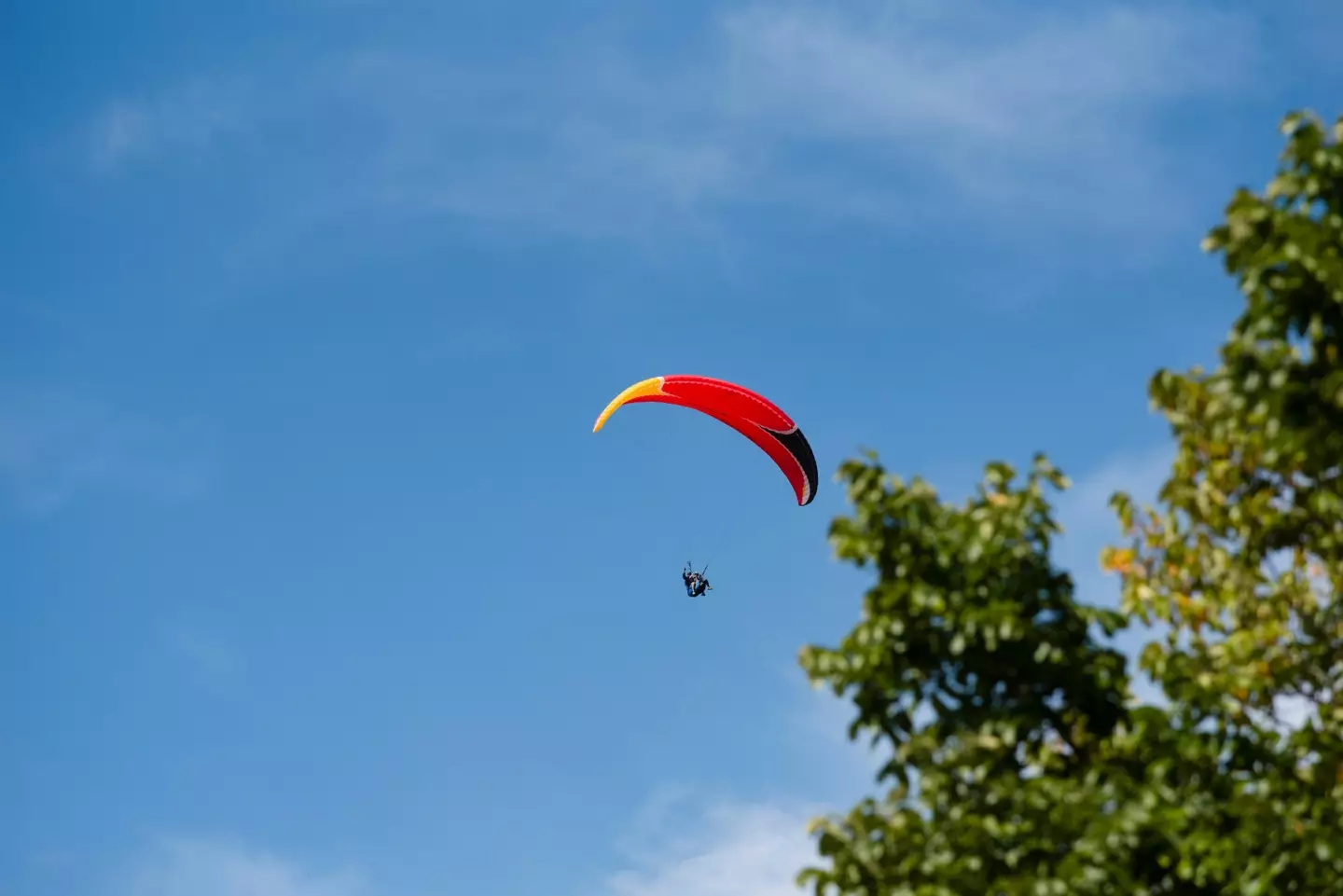 A skydiver has died after landing on a pre-game ceremony at a high school football match.