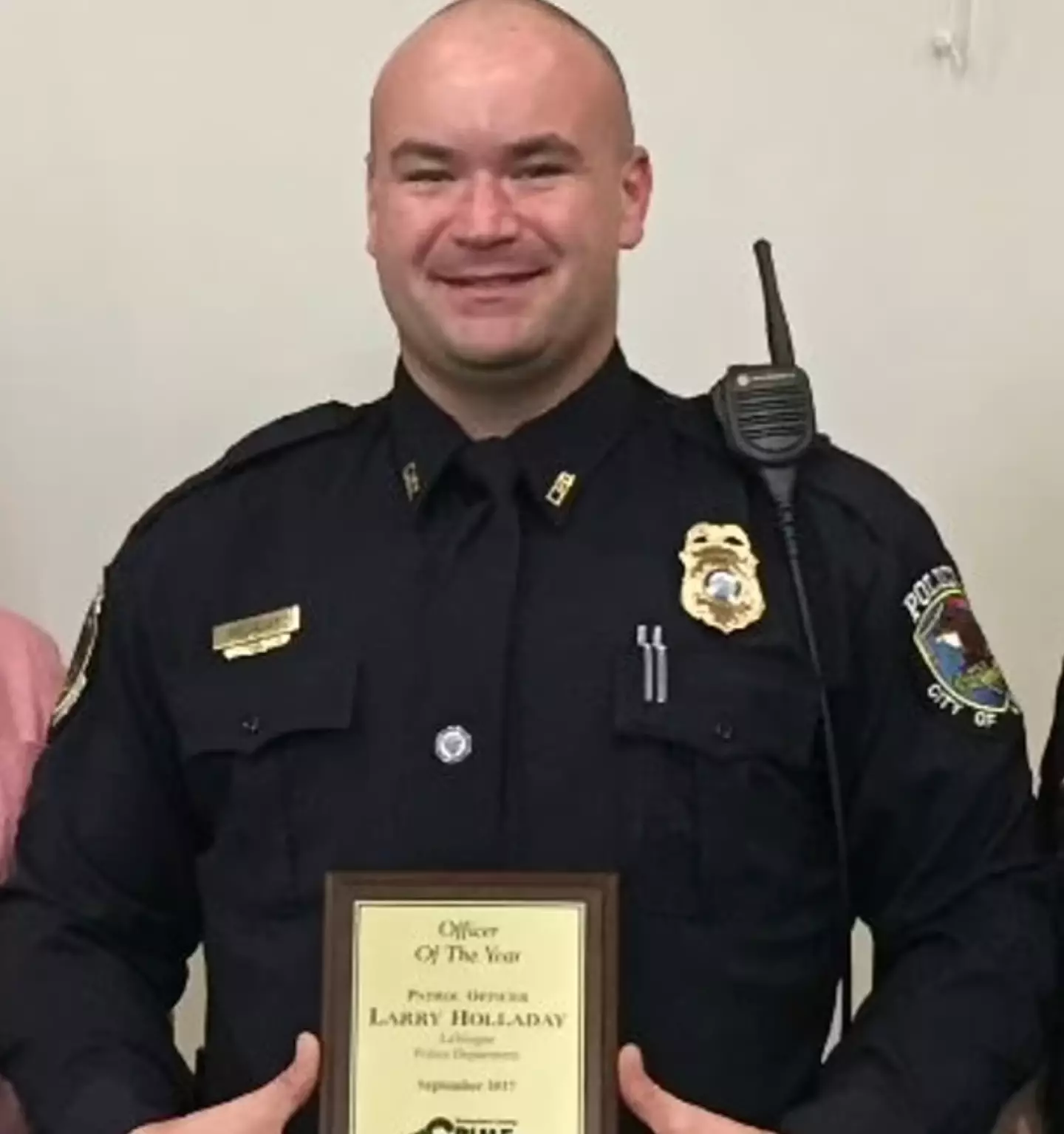 Officer Larry Holladay was suspended after admitting to having an affair with Hall.