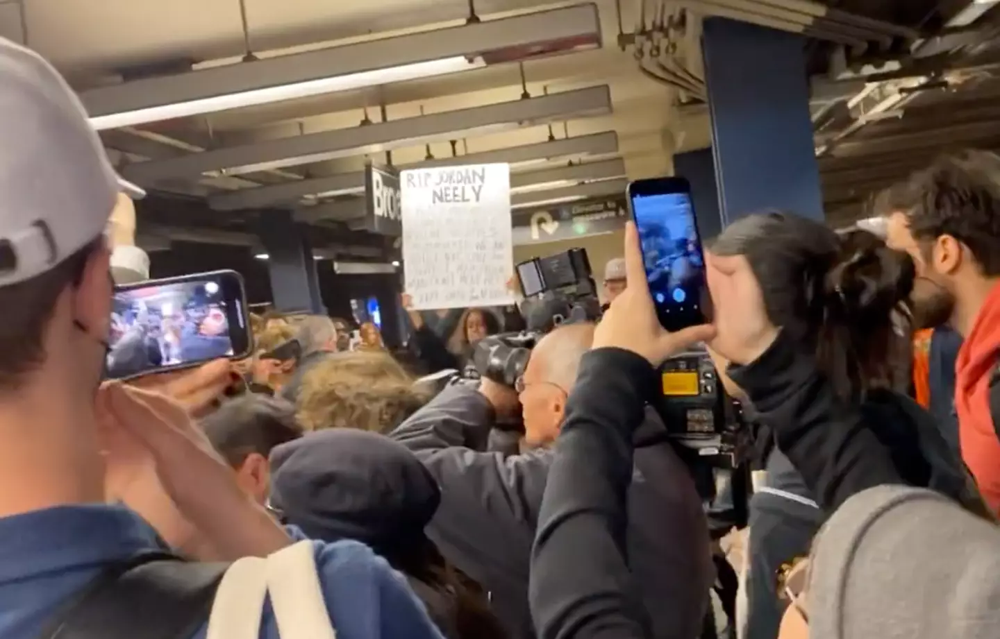 Protestors gathered at the subway station to protest Neely's death.