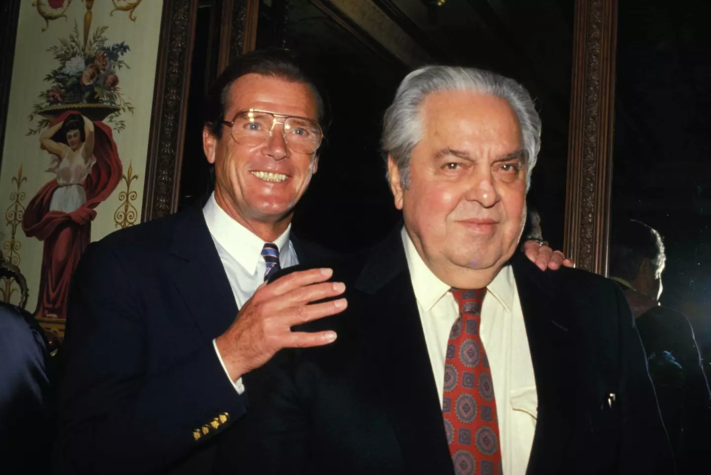 Cubby Broccoli and James Bond's Roger Moore.