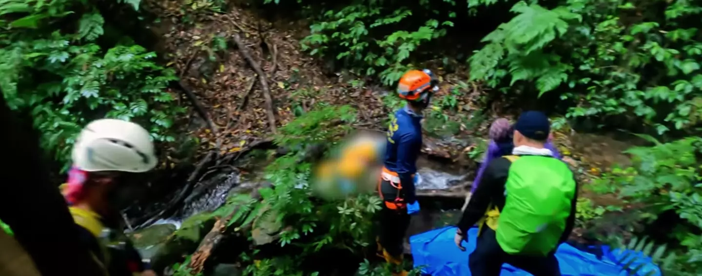 The moment a search team in Taiwan found the lifeless body of a millionaire was caught on camera.