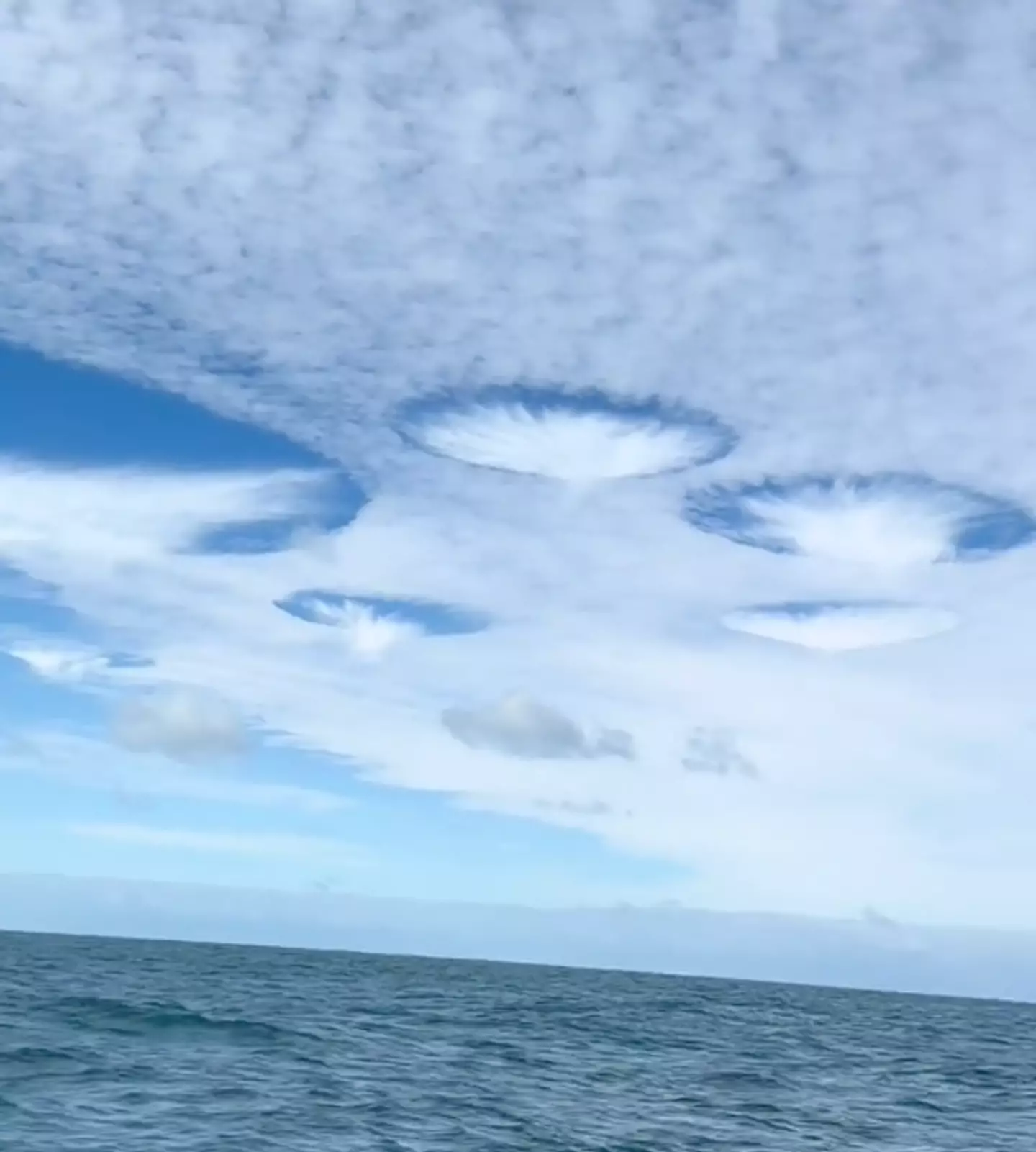 NASA explained that they were cavum clouds, also known as ‘hole-punch clouds’