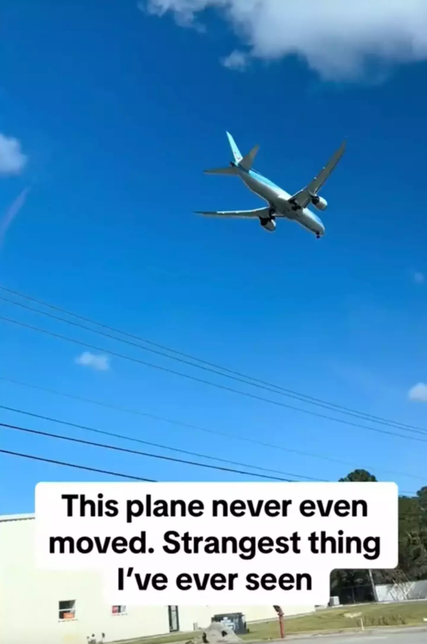 Even as the TikToker drives past, the plane doesn't seem to budge.