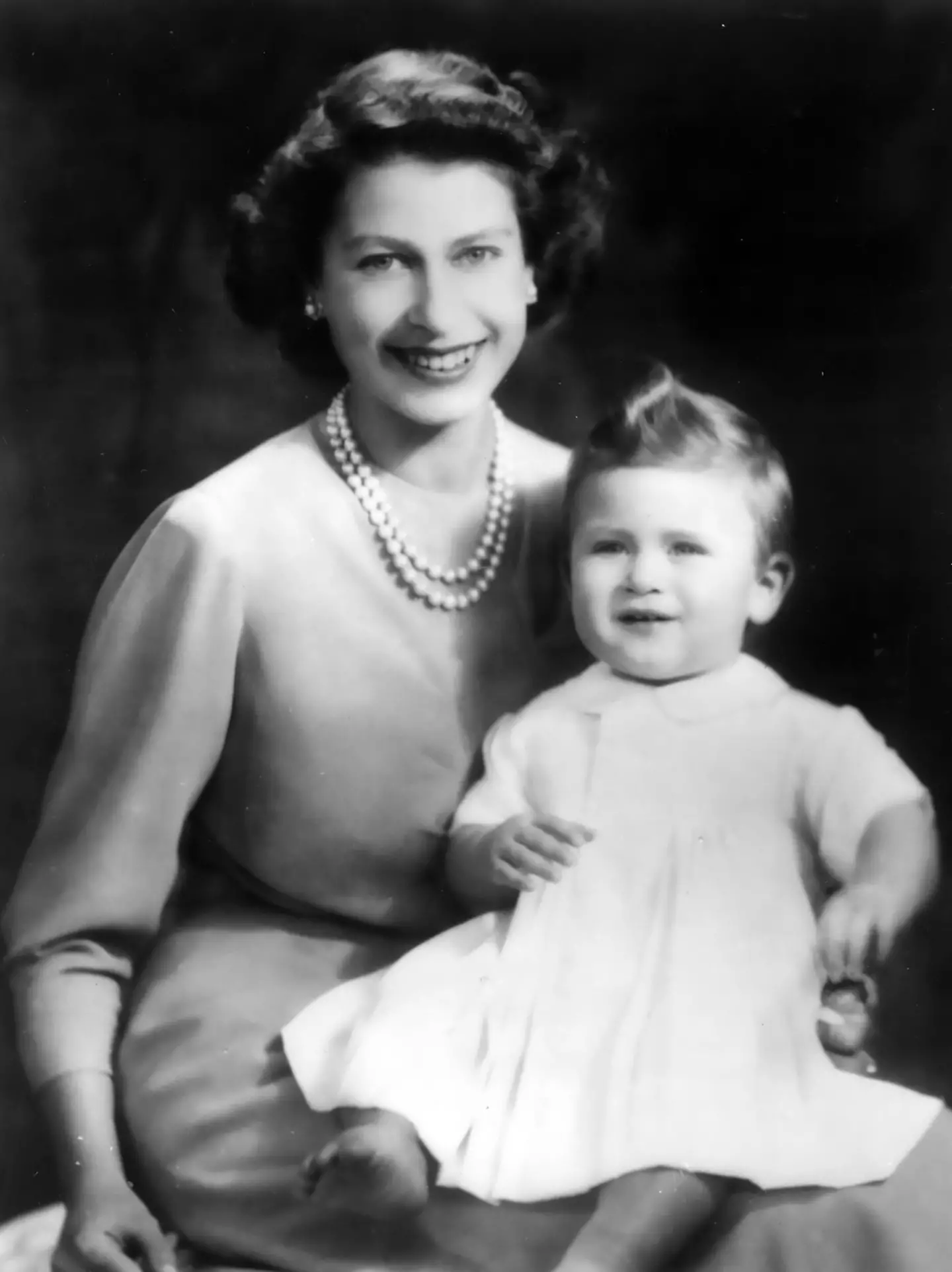 There are later photos of Queen Elizabeth II with baby Charles.