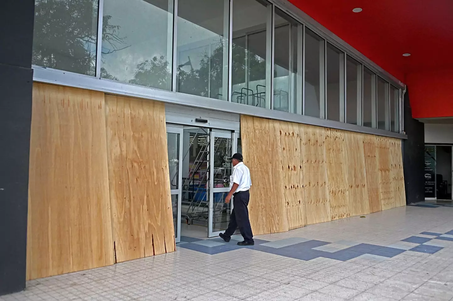 Businesses have been boarding up in anticipation of the storm (FRANCISCO ROBLES/AFP via Getty Images)
