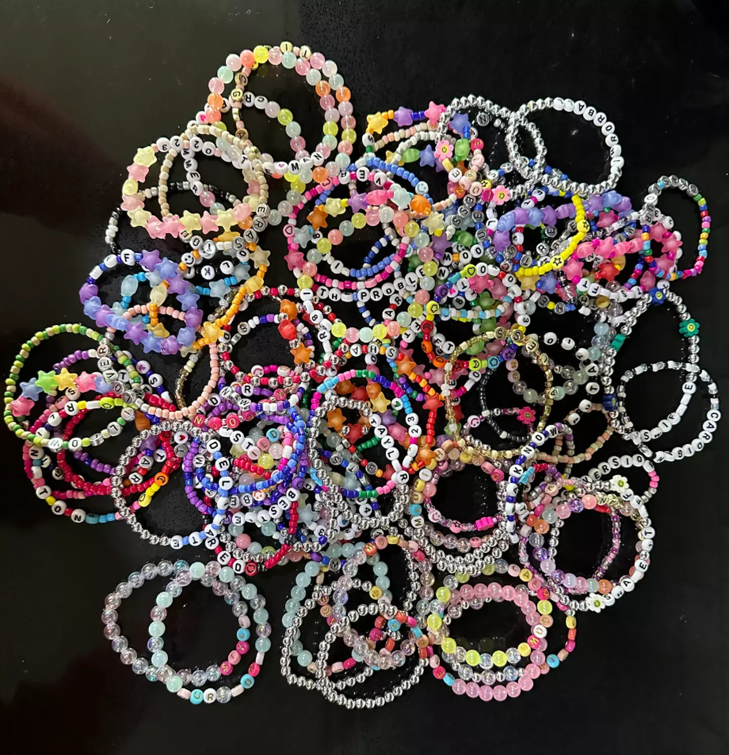 Jamie Tompkins makes dozens of Taylor Swift-themed bracelets.