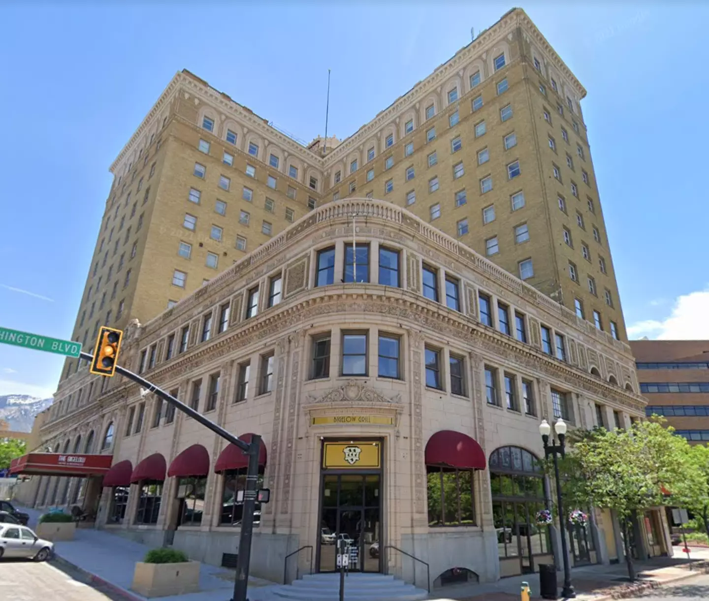 The hotel towers over the surrounding street.