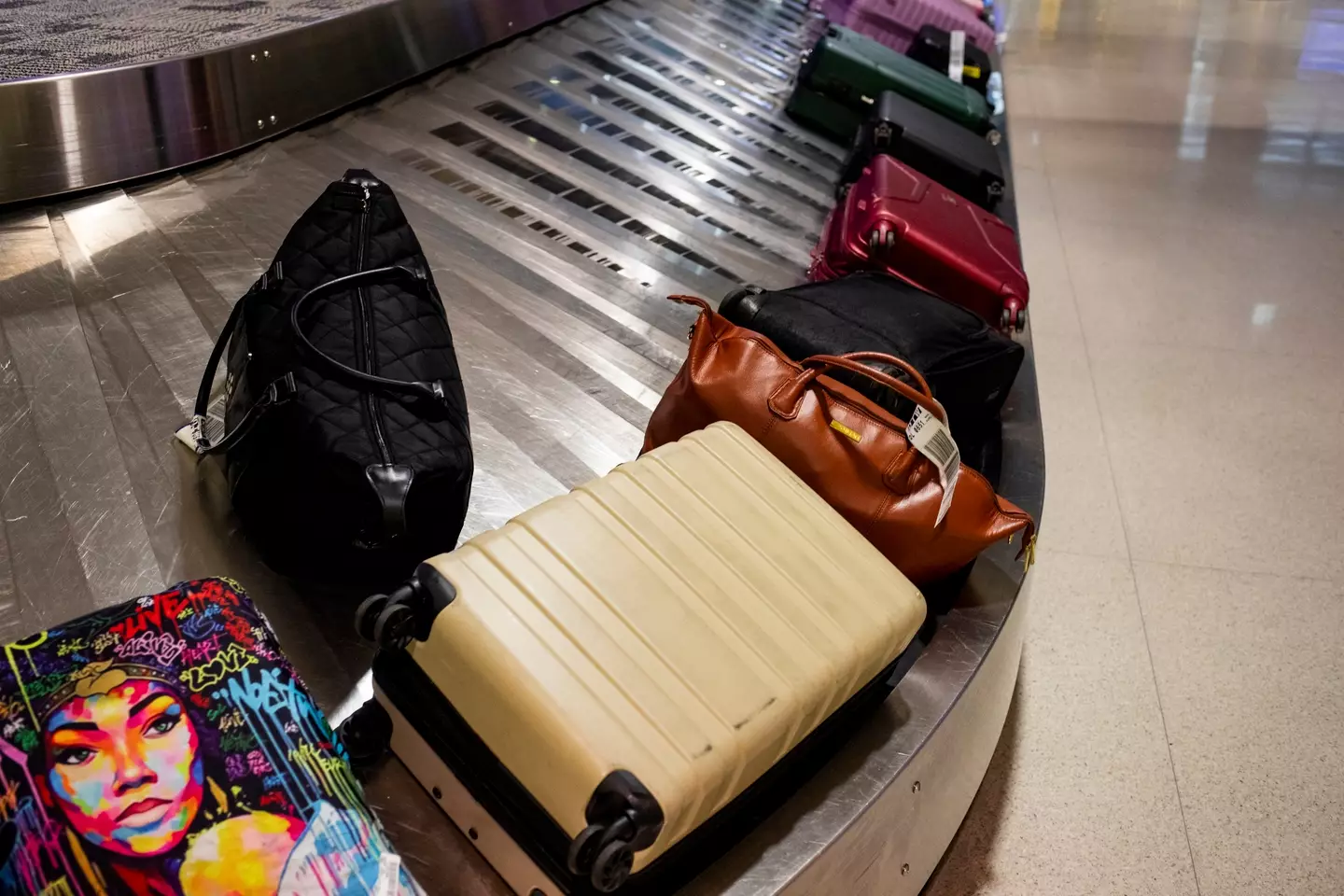 It's advised that you remove old travel stickers from you luggage (Emily Elconin/Getty Images)