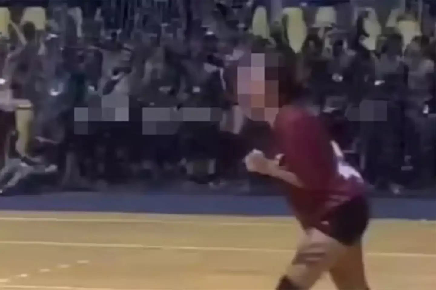 The men had sat on the sidelines of the women's volleyball game with their pants down.