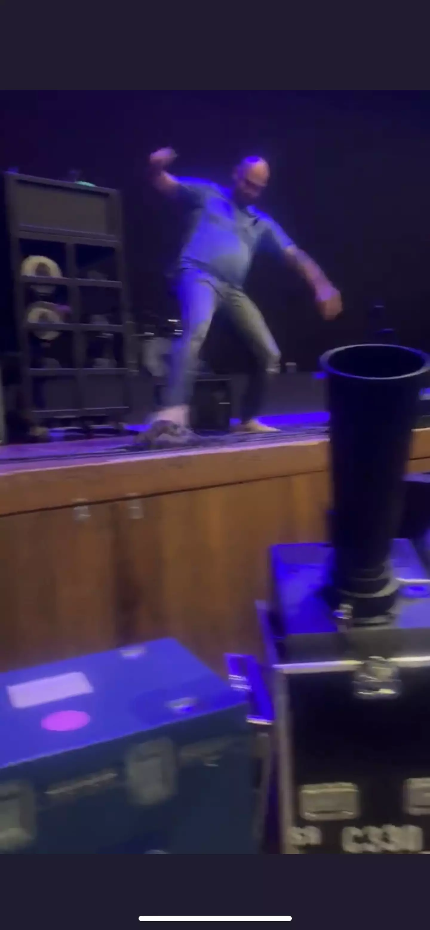 A security guard was seen kicking what appeared to be a squirrel off the stage.