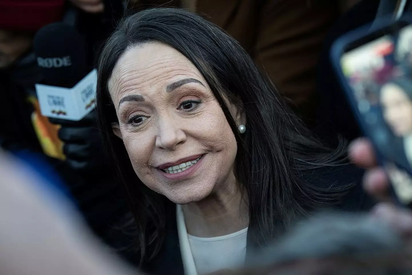 María Corina Machado greets crowds following her meeting with Donald Trump ( Drew ANGERER / AFP via Getty Images)