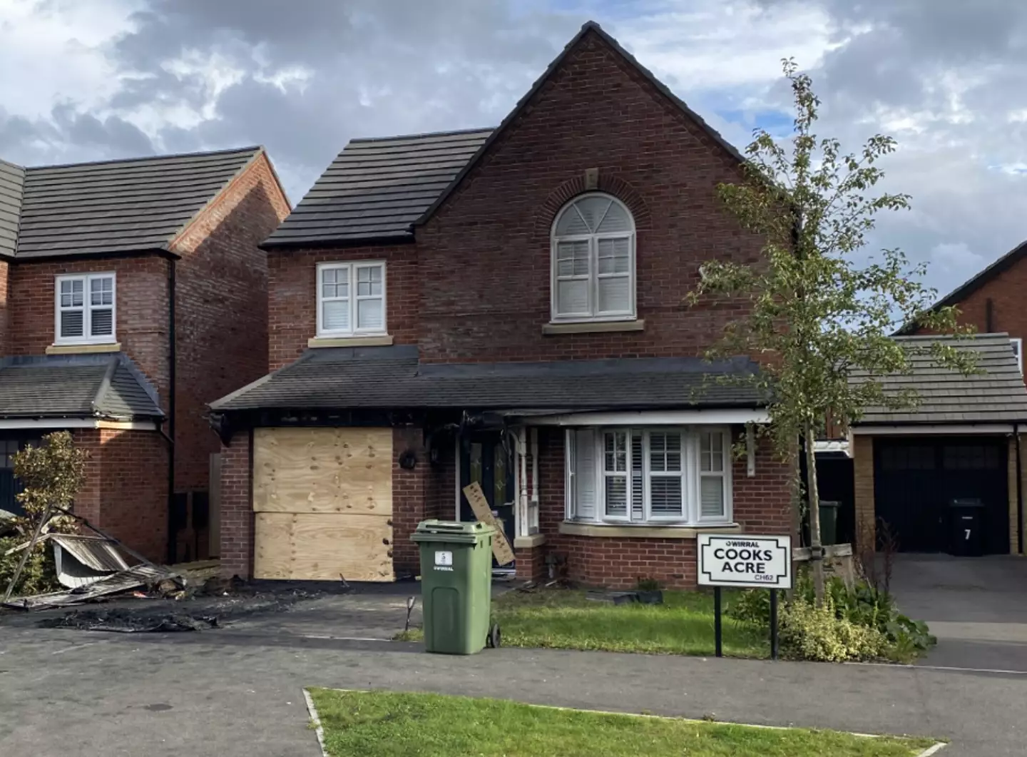 Both the garage and car were on fire.