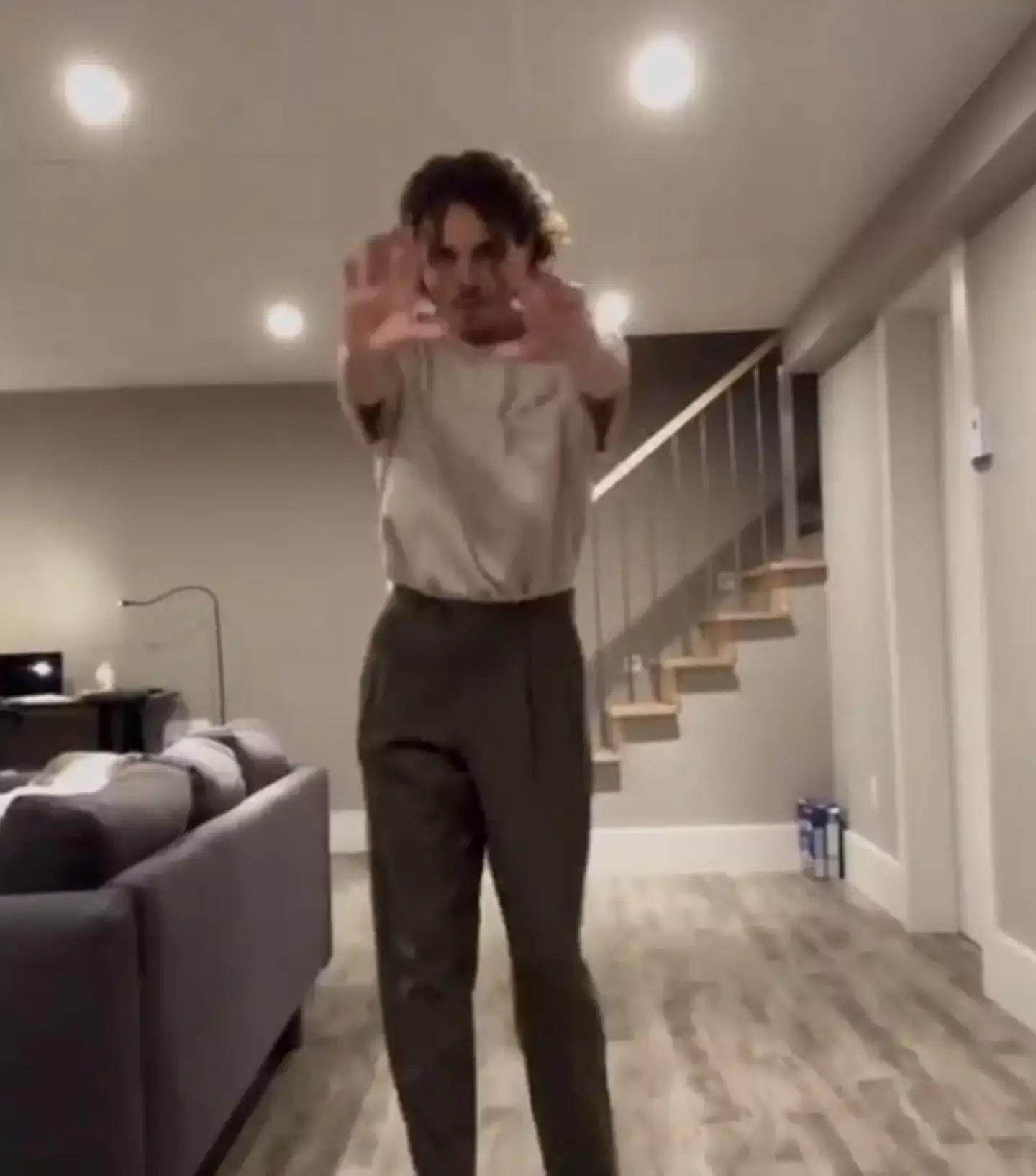 People have spotted a terrifying figure in a video of a TikTok dancer who was home alone.